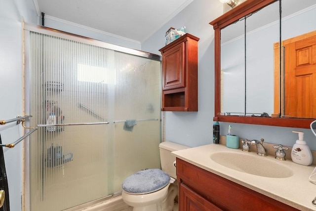 bathroom with a stall shower, vanity, toilet, and crown molding