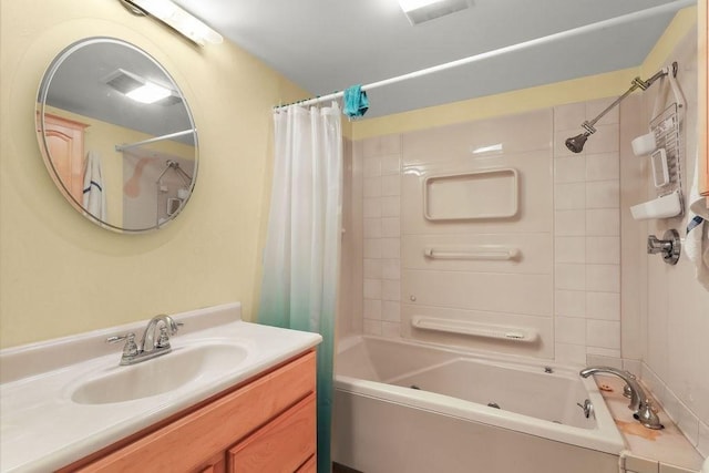 bathroom with shower / tub combo, visible vents, and vanity