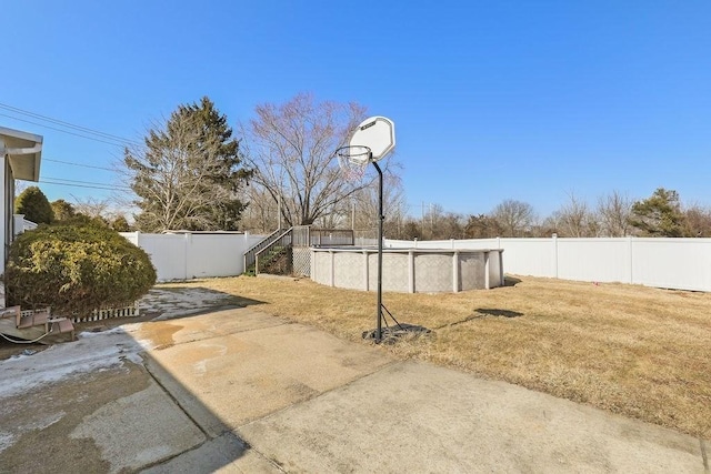 exterior space with a fenced backyard and a fenced in pool