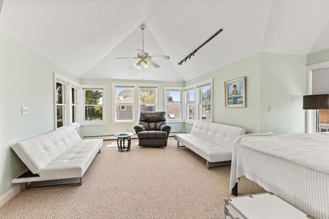 bedroom with lofted ceiling, carpet floors, baseboards, ceiling fan, and baseboard heating