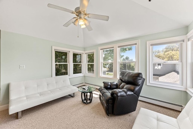 carpeted living area with a baseboard heating unit, a ceiling fan, and vaulted ceiling