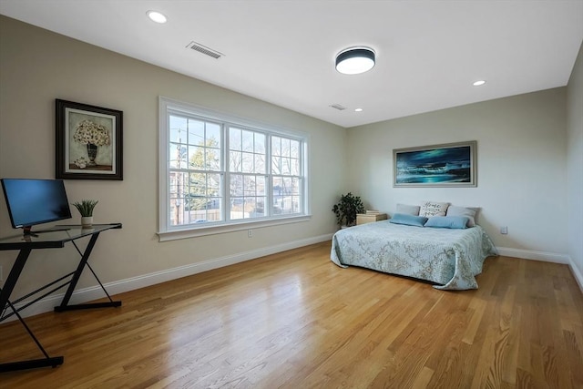 bedroom with light hardwood / wood-style flooring