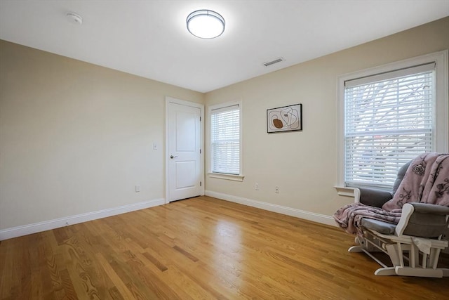 sitting room with light hardwood / wood-style floors