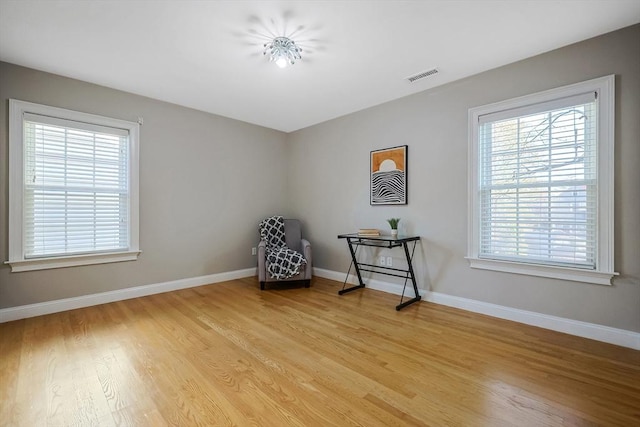 sitting room featuring light hardwood / wood-style flooring