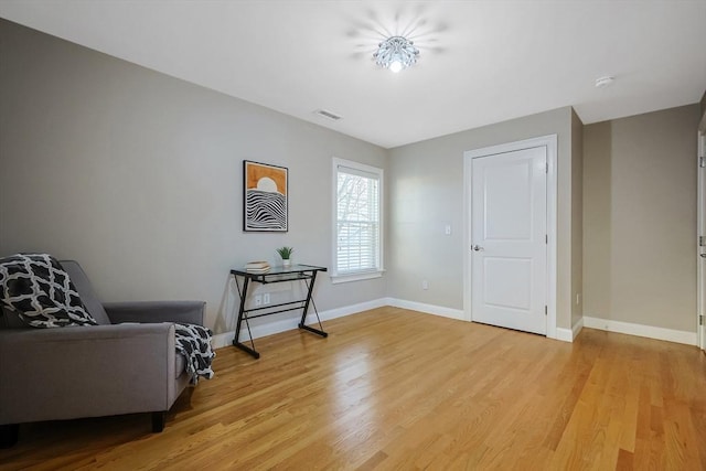 sitting room with light hardwood / wood-style floors