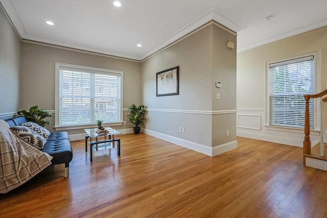 sitting room featuring light hardwood / wood-style floors and crown molding