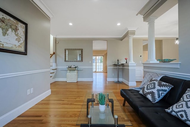 living room with wood-type flooring and crown molding