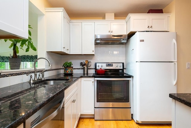 46 Plum St, Hamilton, MA 01982 - kitchen featuring stainless steel appliances, under cabinet range hood, white cabinets, and dark stone countertops