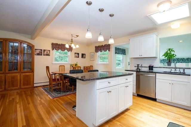 46 Plum St, Hamilton, MA 01982 - kitchen featuring stainless steel dishwasher, light wood finished floors, a chandelier, a kitchen island, and beamed ceiling