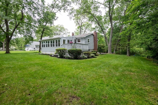 46 Plum St, Hamilton, MA 01982 - rear view of house with a chimney, a yard, and a deck