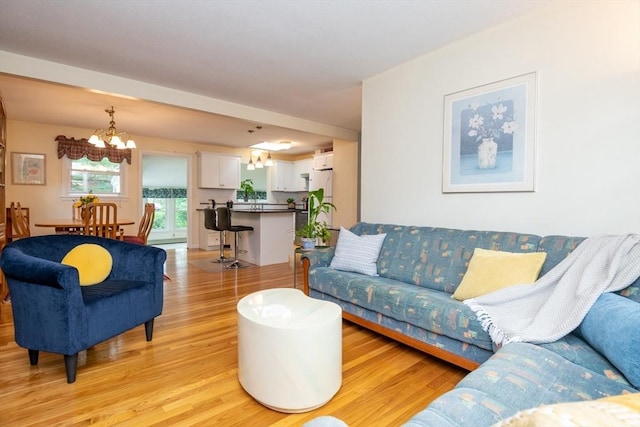 46 Plum St, Hamilton, MA 01982 - living room with a chandelier and light wood finished floors