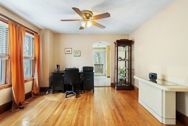 57 Taft St, Medford, MA 02155 - office area with arched walkways, light wood-style flooring, baseboards, and ceiling fan