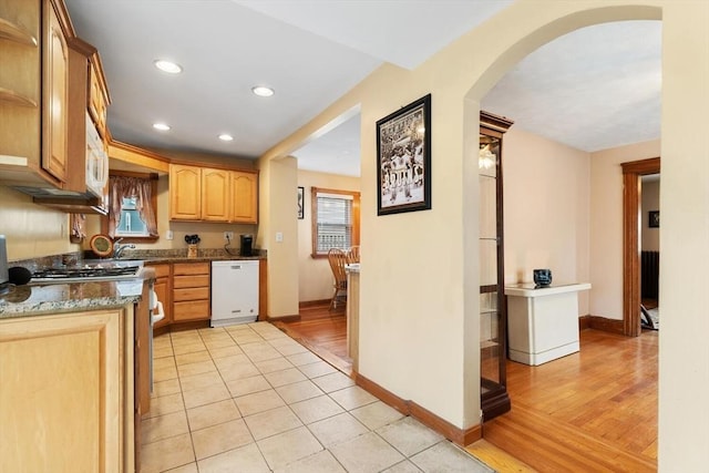 57 Taft St, Medford, MA 02155 - kitchen featuring white appliances, arched walkways, baseboards, recessed lighting, and light brown cabinets