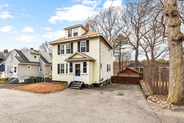 57 Taft St, Medford, MA 02155 - american foursquare style home with entry steps, a chimney, and asphalt driveway