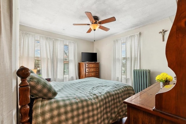 57 Taft St, Medford, MA 02155 - bedroom featuring radiator, multiple windows, and a ceiling fan