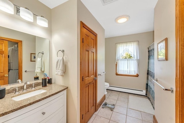 bathroom with a baseboard heating unit, toilet, tile patterned flooring, vanity, and a shower with curtain