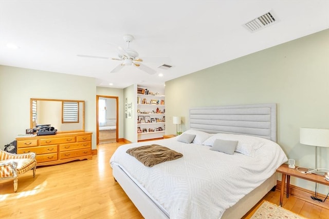 bedroom featuring wood finished floors, recessed lighting, a ceiling fan, and baseboards