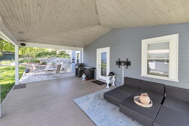 view of patio / terrace with a deck, grilling area, and outdoor dining area