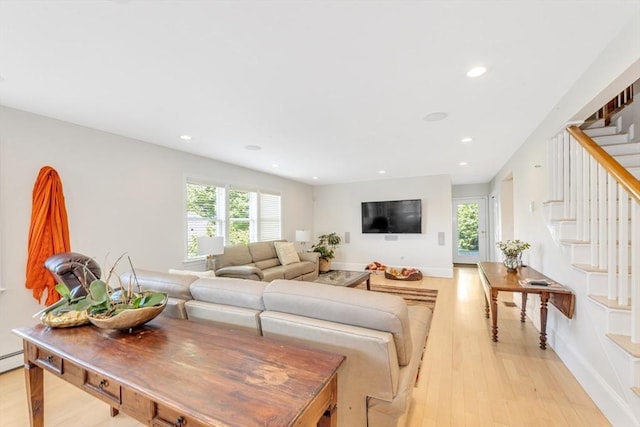 living area featuring stairway, light wood-type flooring, recessed lighting, and baseboards