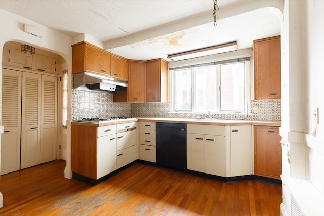 kitchen with dark wood-type flooring, white cabinetry, black dishwasher, and gas cooktop