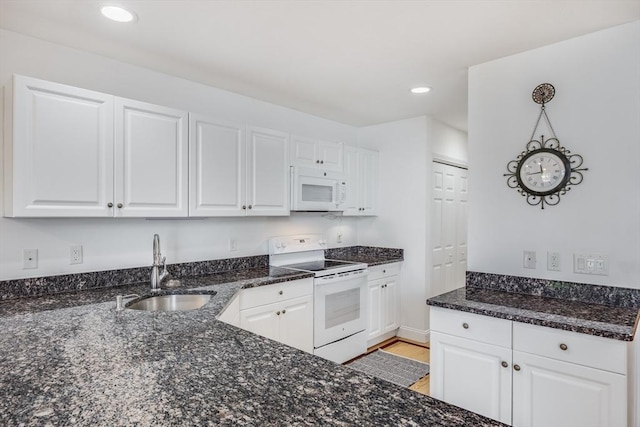 13 Laurel Hill Ct Unit 13, Bourne, MA 02532 - kitchen with white appliances, white cabinets, dark stone counters, and recessed lighting