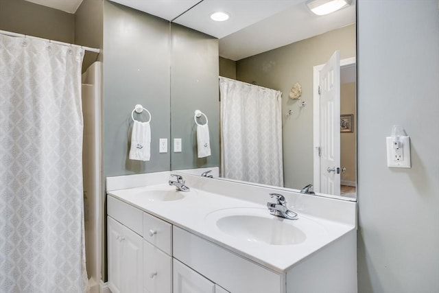 13 Laurel Hill Ct Unit 13, Bourne, MA 02532 - bathroom with double vanity and a shower with curtain