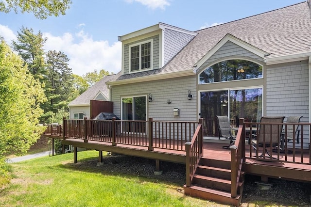 13 Laurel Hill Ct Unit 13, Bourne, MA 02532 - back of property featuring a shingled roof, a wooden deck, a yard, and outdoor dining area