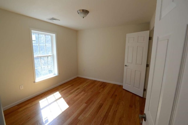 unfurnished room featuring light wood-type flooring