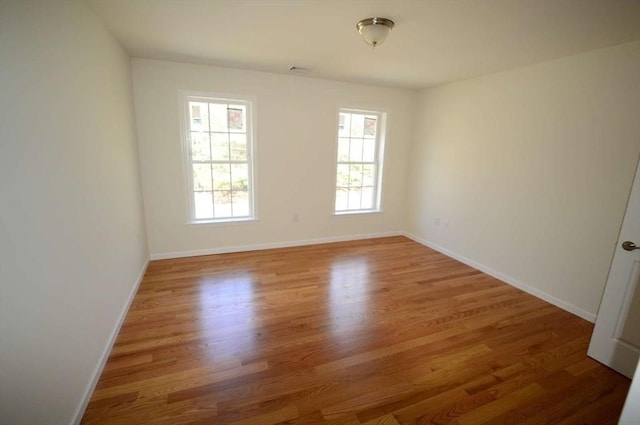 empty room with wood-type flooring