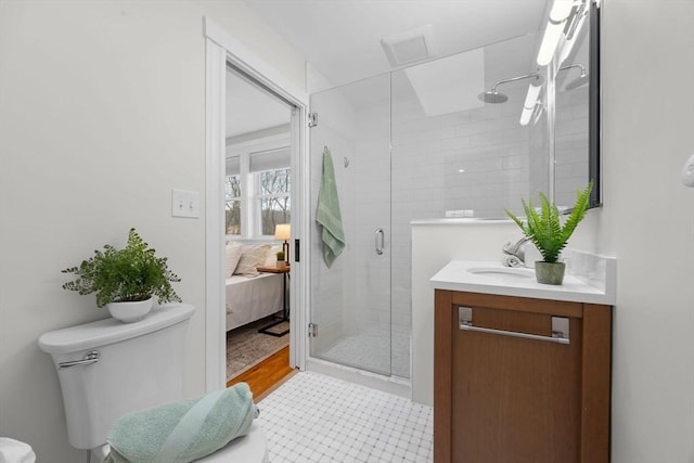 bathroom with vanity, toilet, and walk in shower