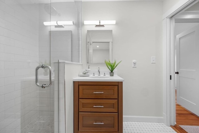 bathroom featuring an enclosed shower and vanity