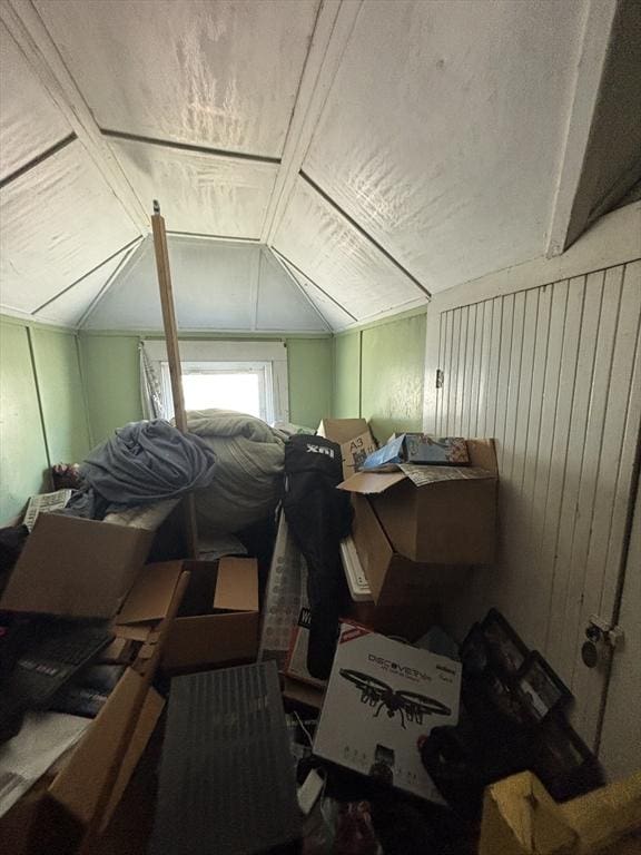 additional living space featuring lofted ceiling