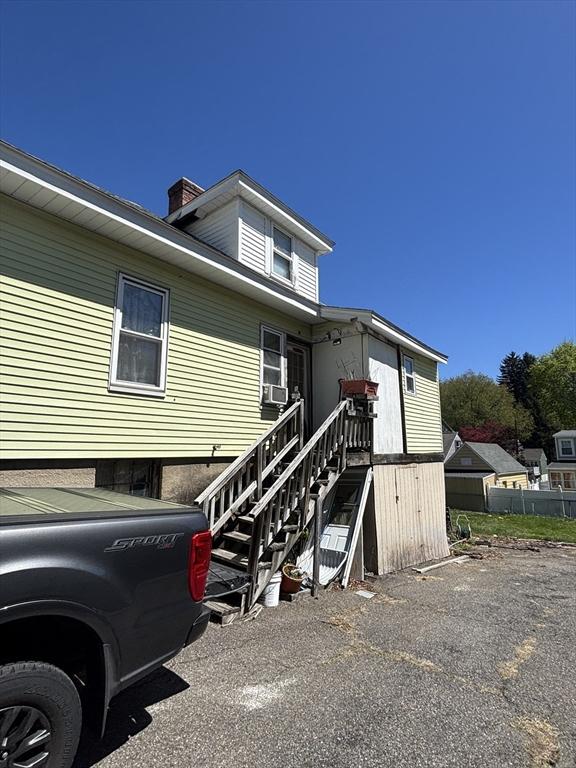 view of front of house with fence and a chimney