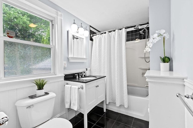 109 Bouve Ave, Brockton, MA 02301 - bathroom with tile patterned floors, toilet, shower / tub combo, vanity, and wainscoting