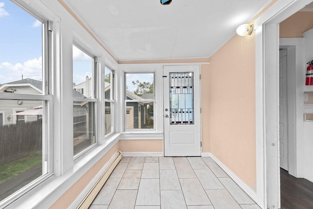 109 Bouve Ave, Brockton, MA 02301 - unfurnished sunroom featuring a baseboard radiator, baseboards, tile patterned floors, and crown molding
