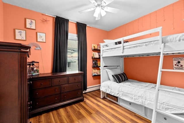 109 Bouve Ave, Brockton, MA 02301 - bedroom featuring wood finished floors, a baseboard radiator, and ceiling fan
