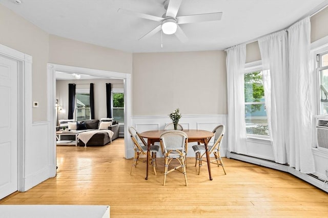109 Bouve Ave, Brockton, MA 02301 - dining space with a wainscoted wall, light wood finished floors, ceiling fan, and a baseboard radiator