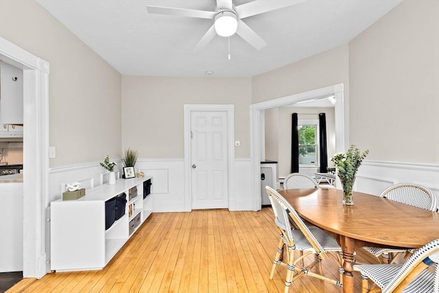 109 Bouve Ave, Brockton, MA 02301 - dining area with wainscoting, a ceiling fan, and light wood-style floors