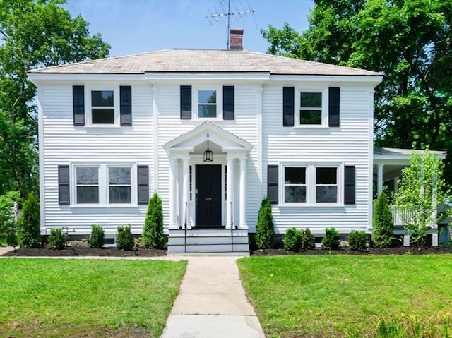 8 Carisbrooke St, Andover, MA 01810 - view of front of home featuring a front yard and a chimney