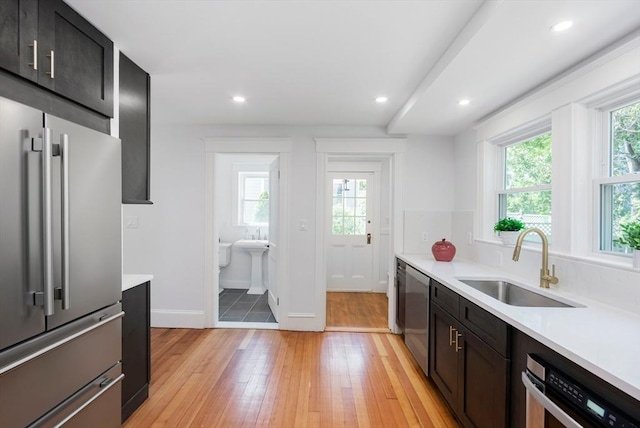 8 Carisbrooke St, Andover, MA 01810 - kitchen featuring stainless steel appliances, plenty of natural light, light countertops, light wood finished floors, and recessed lighting