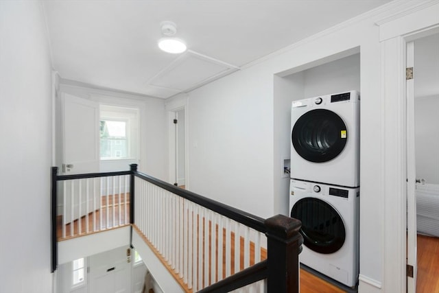8 Carisbrooke St, Andover, MA 01810 - washroom with stacked washer / dryer and wood finished floors