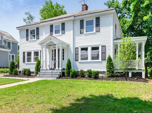 8 Carisbrooke St, Andover, MA 01810 - view of front facade featuring a front yard and a chimney