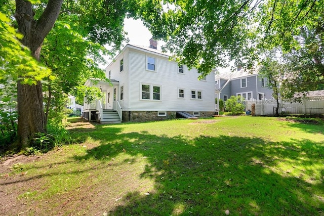 8 Carisbrooke St, Andover, MA 01810 - rear view of property with a chimney