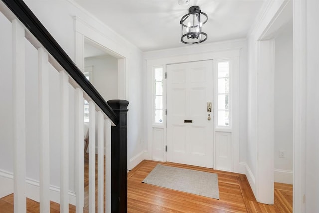 8 Carisbrooke St, Andover, MA 01810 - foyer entrance with light wood-type flooring and stairs