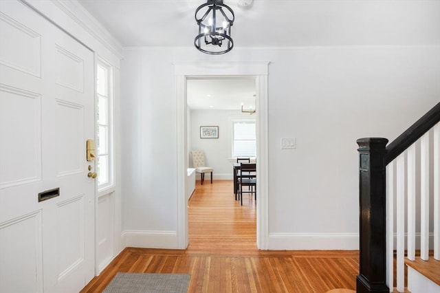 8 Carisbrooke St, Andover, MA 01810 - entrance foyer with a chandelier, light wood-style floors, and stairway