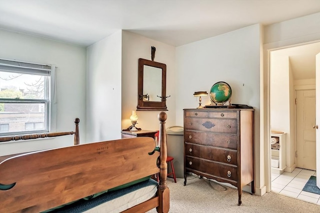 bedroom featuring light carpet