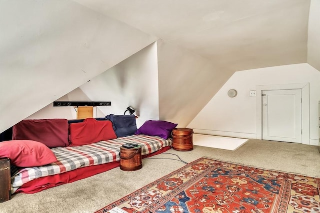 living area featuring carpet floors and lofted ceiling