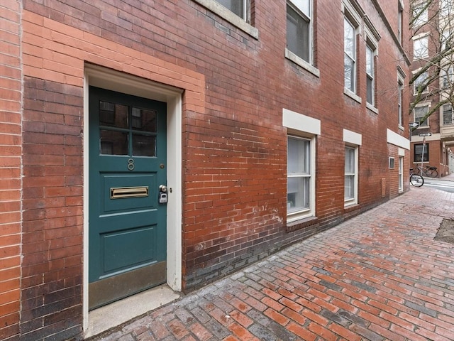 entrance to property with brick siding