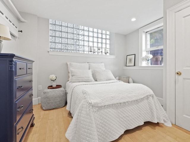 bedroom with recessed lighting and light wood finished floors