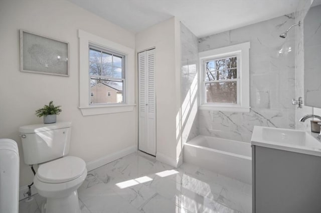 full bathroom with a bathing tub, marble finish floor, toilet, and baseboards